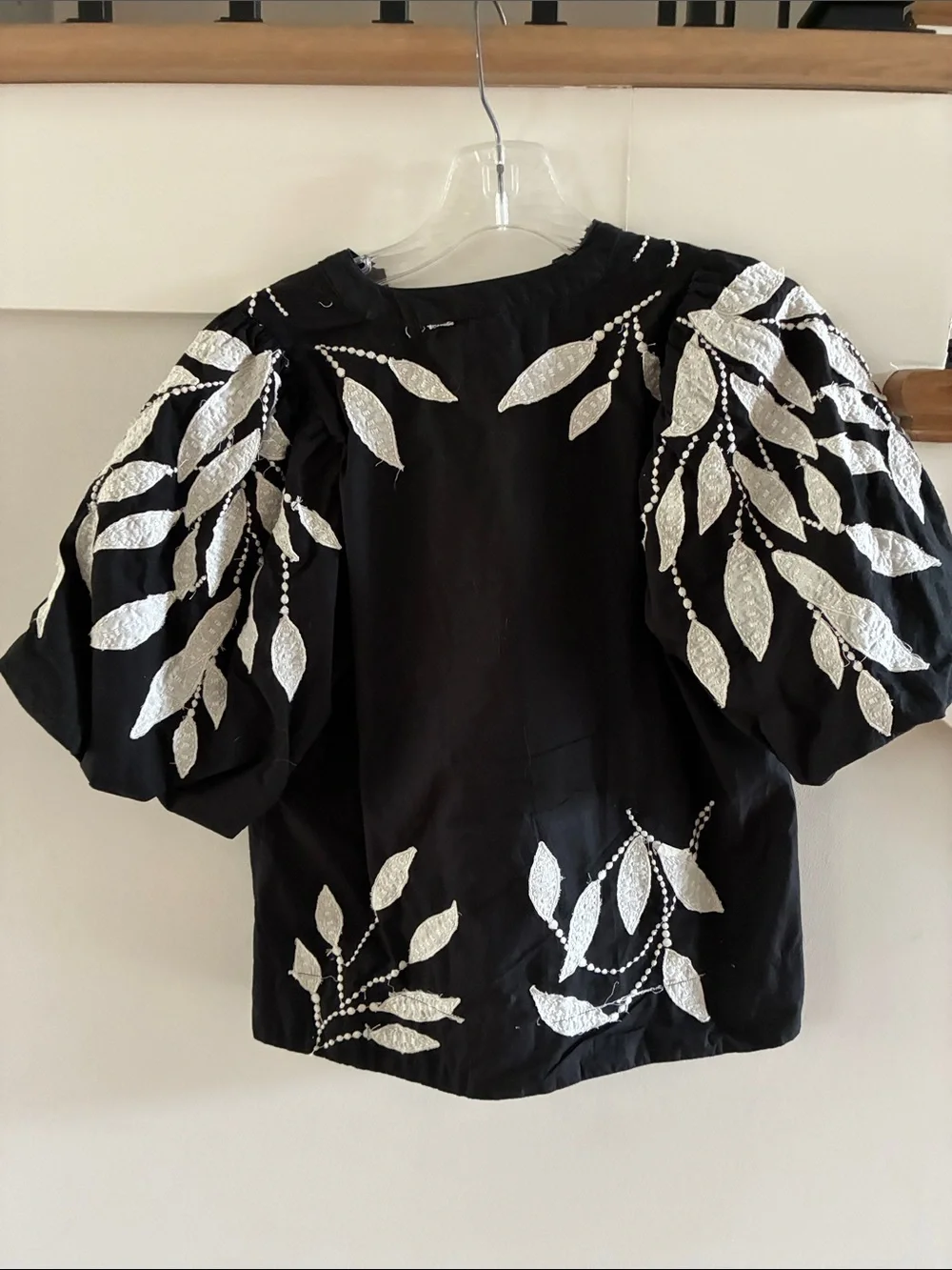 By Anthropologie Black V-Neck Blouse with White Leaf Motif